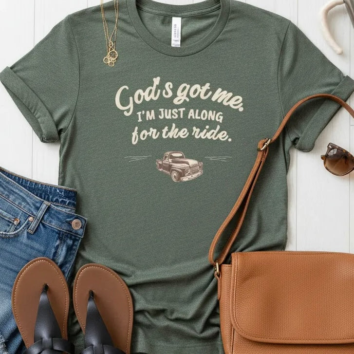 God’s Got Me, I’m Just Along for the Ride Tee